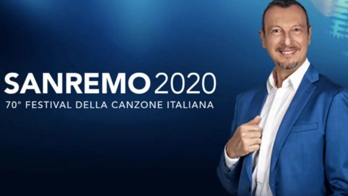 Sanremo 2020: presentati i big in gata. nella foto, un primo piano di amadeus, che indossa una giacca blu, sopra una camicia bianca, con di fianco il logo della manifestazione