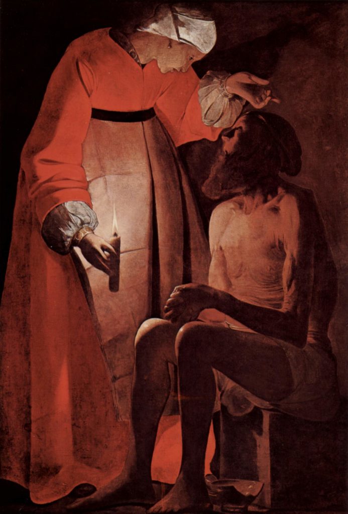 George de La Tour il maestro della luce  in un suo dipinto. A Palazzo Reale Milano La moglie con candela in mano e Giobbe seduto discinto davanti a lei