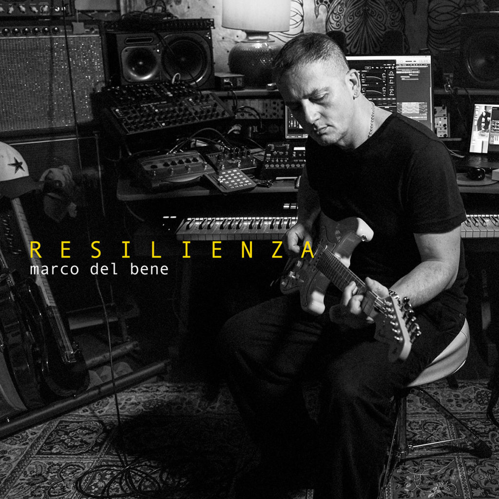 “Resilienza” il nuovo progetto di Marco Del Bene aka Korben Mkdb. la copertina del disco che ritrae l'autore, che indossa una t-shirt nera, in uno studio di registrazione, intento a suonare una chitarra elettrica