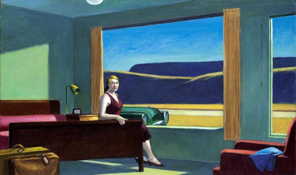 Donna seduta in stanza d'albergo con vestito vinaccia. Edward Hopper l'artista del tempo sospeso