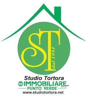 trattativa casa - il logo dell'imoobiliare Punto Verde Studio tortora con un pallino verde e sopra un tetto e nel pallino le iniziali "ST"