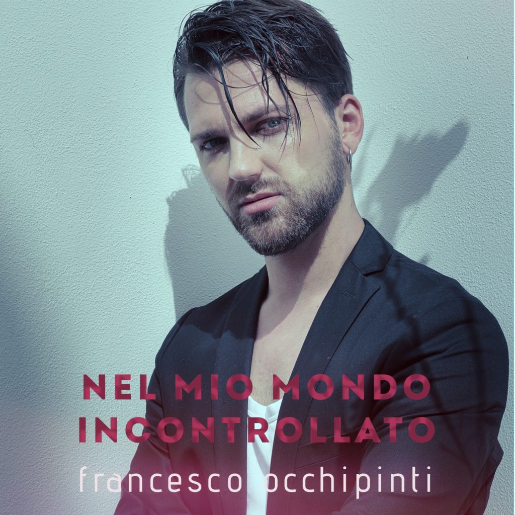 nel mio mondo incontrollato - la copertina del singolo che ritrae francesco occhipinti in primo piano, capelli scuri, barba e giacca nera