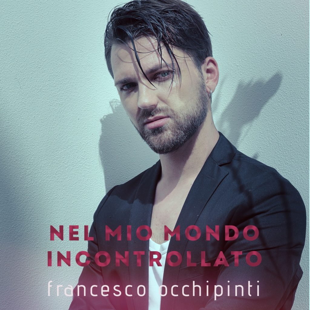 nel mio mondo incontrollato -  la copertina del singolo che ritrae francesco occhipinti in primo piano, capelli scuri, barba e giacca nera