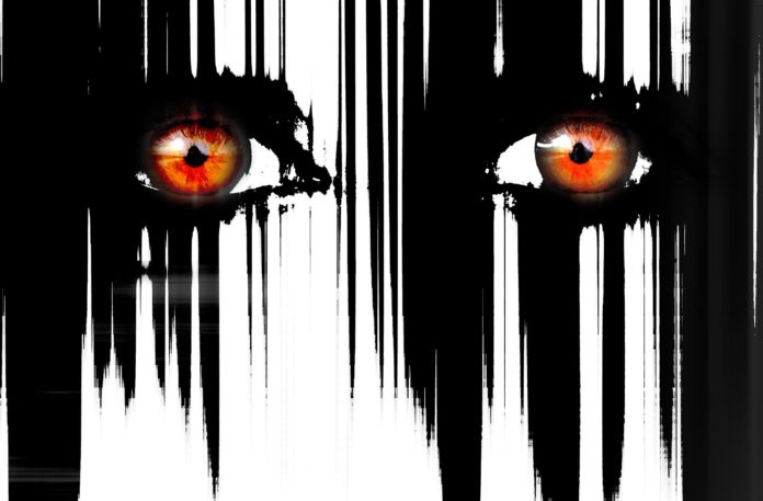 cinema horror shock - due occhi grandi rossi e delle righe nere di diverso spessore che scendono come capelli sul viso senza naso e bocca