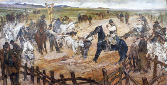 Una scena di un rodeo dell'ottocento con tanti uomii a cavallo alle prese con la cattura di tori e mucche
