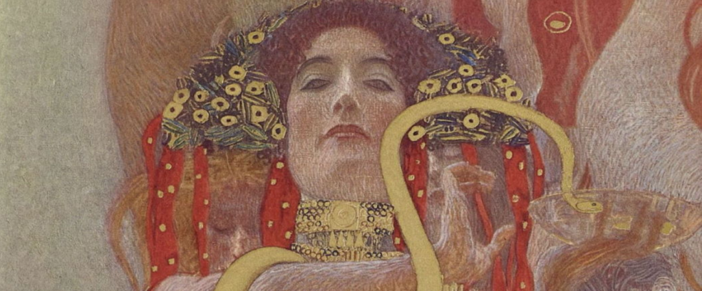 2022 le mostre da non perdere: da Canova a Klimt, passando per i Surrealisti. viso di donna di Klimt toni rosso arancio e oro