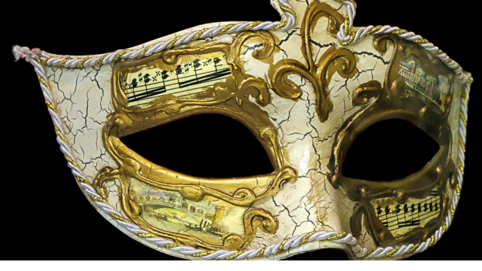 Il primo Teatro Stabile in Carcere del mondo. maschera da teatro veneziano bianc e oro su fondo nero