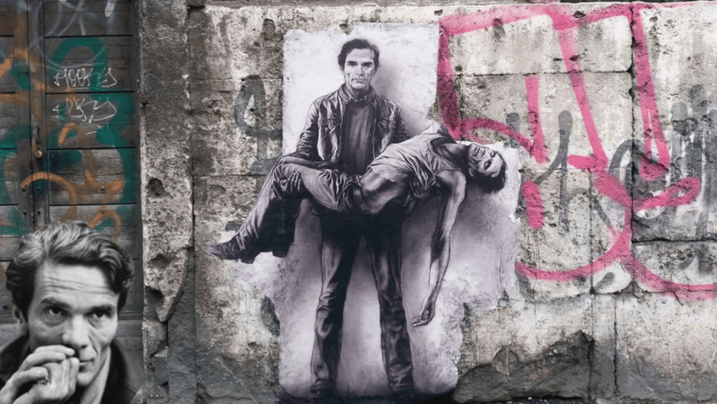 Murales di Pier Paolo Pasolini ritratto in seppia come la pietà di Michelangelo muro scrostato con scritte