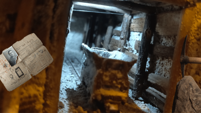 interno miniera di Comiolo con piccone e ruolo paga minatore in alto a sinistra