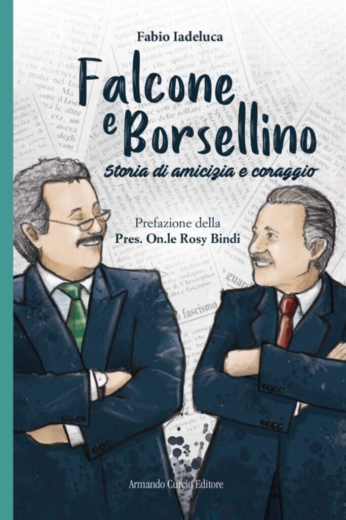 Fabio Iadeluca - la copertina del libro con Falcone e Borsellino storia - nella foto i due giudici in un disegno colorato si guardano e sorridono