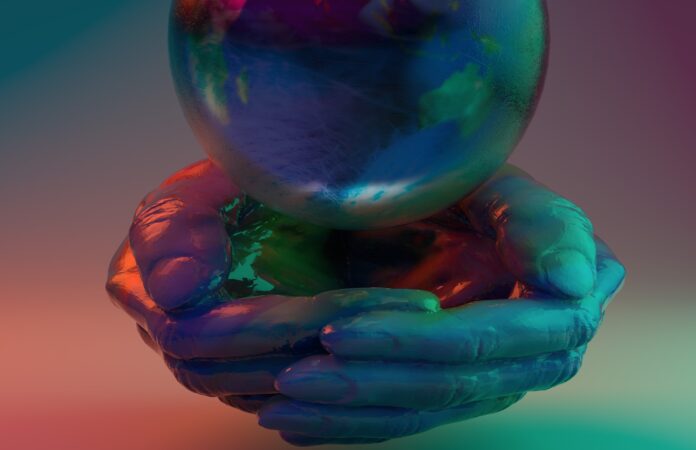 rumba de bodas - todu mundo - un globo colorato di blu e verde sospeso e sotto due mani unite a conca, anch'esse verniciate di verde blue e rosso