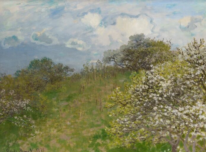 quadreo di claude monet raffigurante la primavera un albero fiorito in un prato