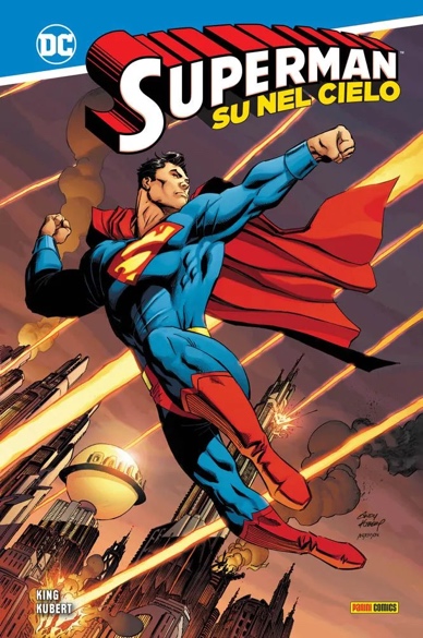 Superman con mantello rosso e tuta blu e una grande S rossa sul petto nlla sua classica posa con il braccio sinistro teso pronto a volare via