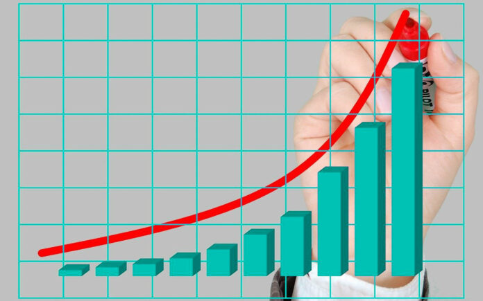 un grafico con tanti rettangoli verticali verdi in fila dal più piccolo al più grande e una mano che disegna una curva in salita rossa