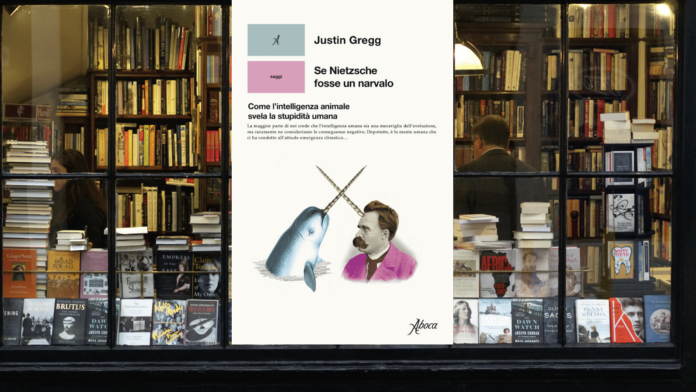 copertina del libro di justin gregg in libreria vetrina con foto nietzsche e narvalo
