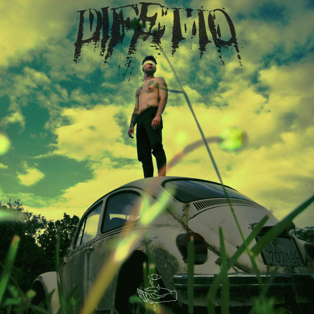 difetto - la copertina del nuovo singolo che raffigura un uomo a torso nudo in piedi sul teto di una vecchia volkswagen bianca