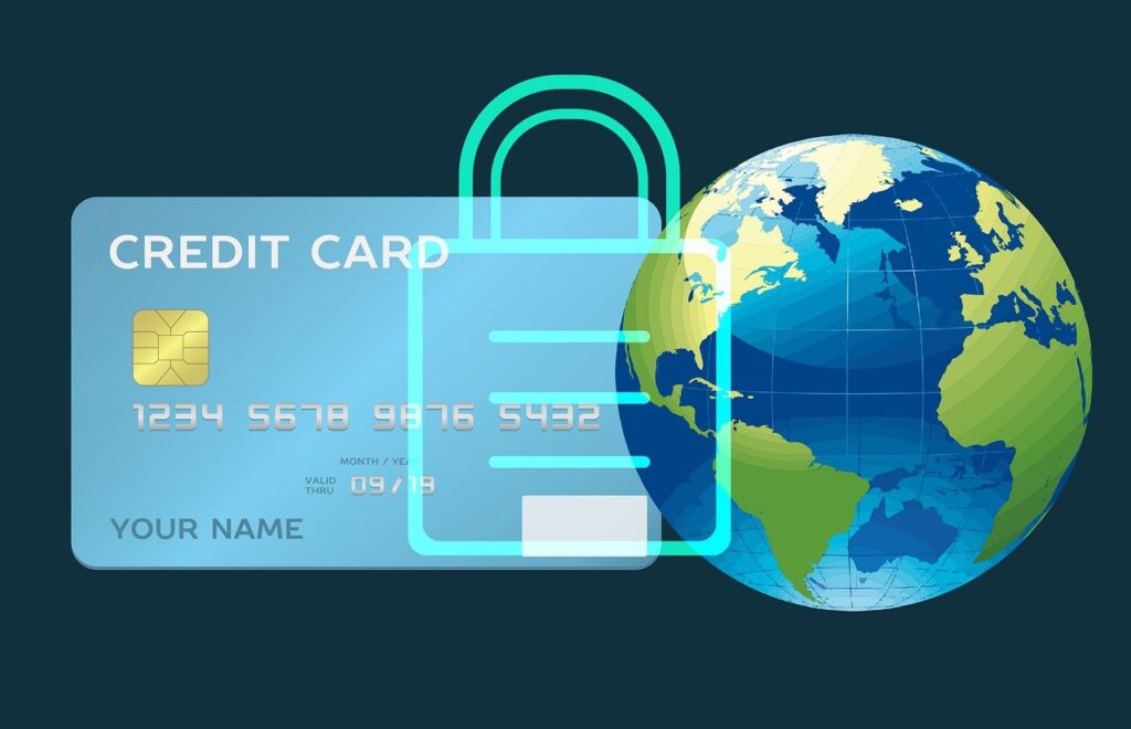 privacy - una carta di crdito blu,vicino al diseegno del mondo con sopra  un lucchetto