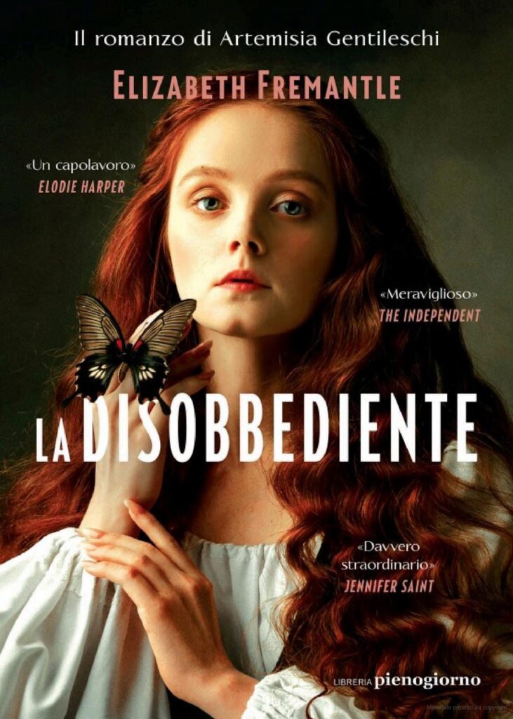 Libri ad arte - nella foto la copertina di un libro con una donna in primo piano, con lunghi capelli rossi, una camicia medievale biuanca