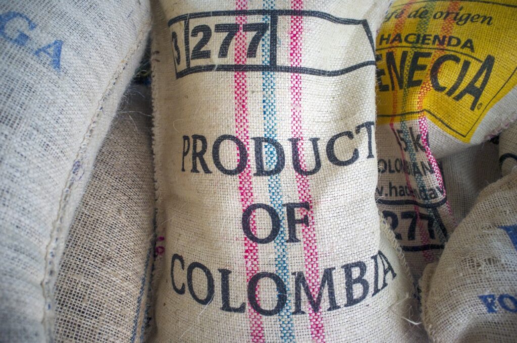 espresso caffè - un sacco di tela pieno di caffè con la scritta product o f columbia