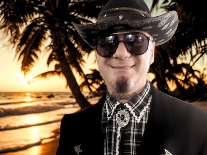 Canzoni Sanremo 2026 - j ax con cappello da cow boy e occhiali scuri ride