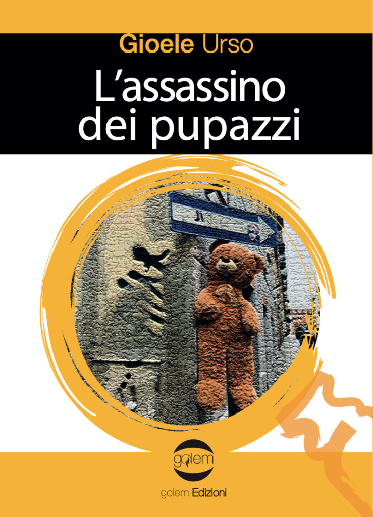 Gioele Ursao - la coeprtina del libro con al centro un cerchio giallo con sfondo nero e nel cerchio un muro di citta con appeso un orsetto di peluches e sopra l orsetto una freccia segnaletica stradale
