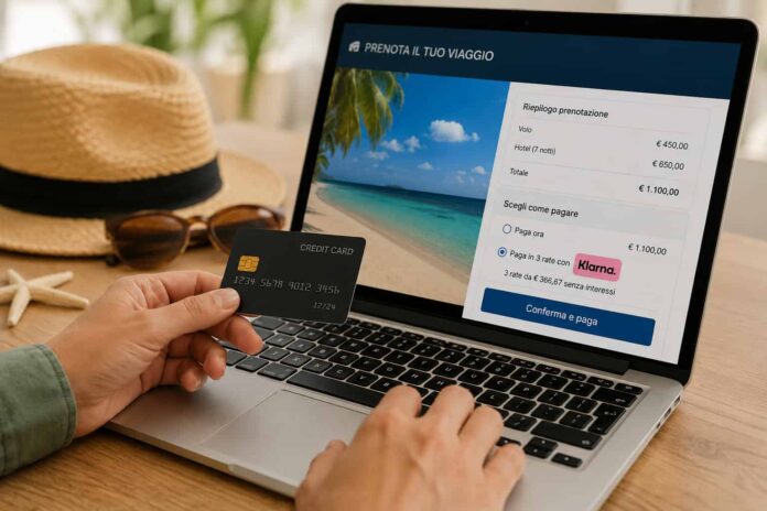 Vacanze a rate la grande trappola del Buy Now Pay Later - zetatielle magazine -foto da comunicato stampa Vacanze a rate - nella foto qualcuno tiene in mano una carta di credito e con l'altra sta compilando un modulo al pc